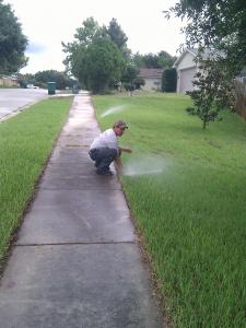 one of our Farifield sprinkler repair techs is checking the sprinkler repair process being good
